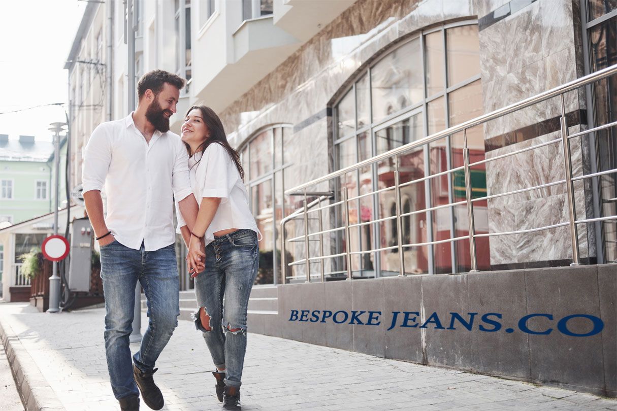 Couple walking in bespoke jeans on a street in America